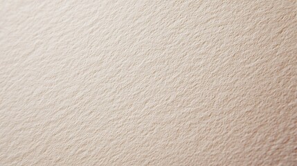 A close-up view of a textured beige wall, showcasing a soft, wavy pattern that adds depth and...