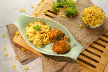 Meatballs Coated in Flour With Creamy Macaroni on a Ceramic Plate