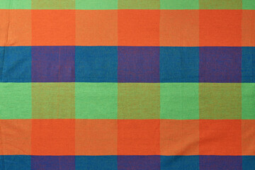 abstract of colorful fabric pattern, handmade craft style product in full frame background or wallpaper backdrop design for cushion, carpet, rug or clothing