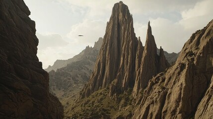 Fototapeta premium Helicopter over rugged canyon, mountain peak, adventure tourism