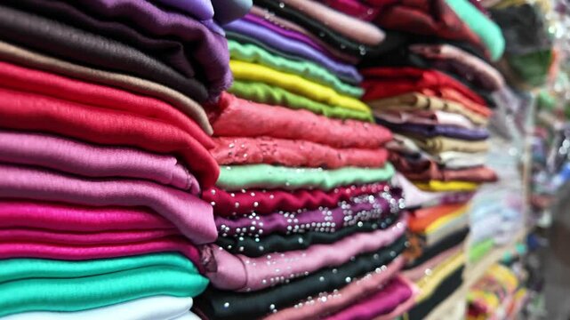 An EyeCatching Stack of Vibrant Textiles on Display in a Market Setting