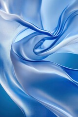A closeup of light blue silk fabric in wavy texture