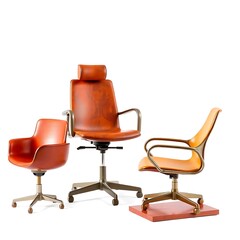 Fototapeta premium Three mid-century modern office chairs in burnt orange leather and metal.