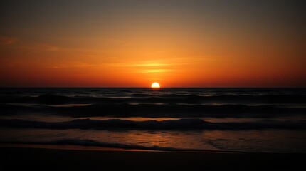 Fototapeta premium Golden light paints the sky as the sun dips below the horizon, casting a mesmerizing reflection on the calm ocean waves
