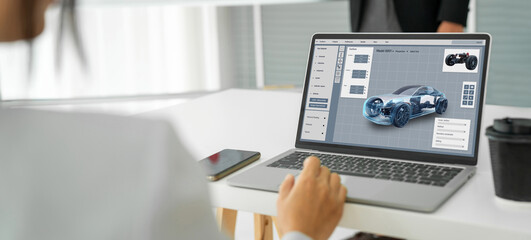 Electric car design software on computer screen showing simulation blueprint snugly by digital calculating application for manufacturing preparation