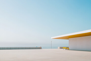 Modern architectural design near the ocean under a clear blue sky