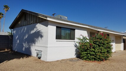 Corner of a One Story House getting Prepped for Paint, Primer Coat On.