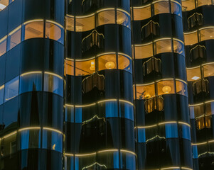 Modern Building with Illuminated Curved Glass Facade
