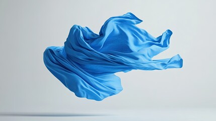 Fototapeta premium A vibrant blue t-shirt seemingly tossed into the air, captured with flowing sleeves and natural folds.