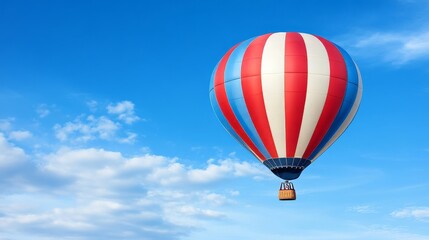 Naklejka premium Hot Air Balloon Soaring High in a Blue Sky