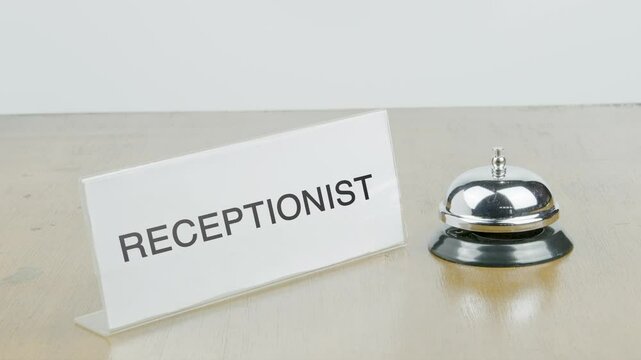 Receptionist Room Office or Room with Hand Ringing The Bell on Desk or Table Multiple Times