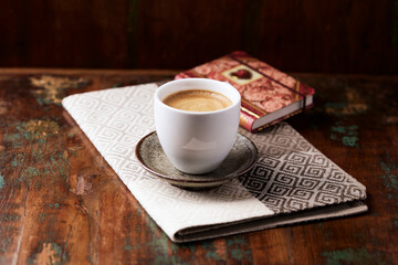 Cup of coffee on wooden background. Soft focus. Copy space.