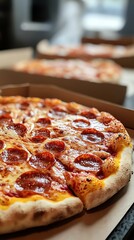 Hot pizza in a branded delivery box placed on a kitchen counter, steaming and ready to eat