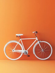 White bicycle on orange wall