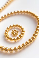 Obraz premium Gold Bead Spiral on White Surface