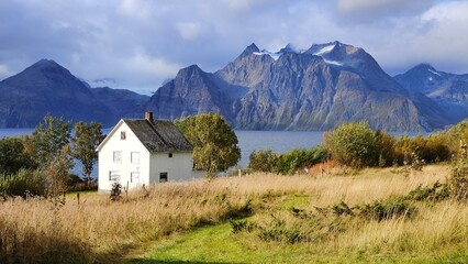 House in colorful autumn mountain landscape in northern Norway
