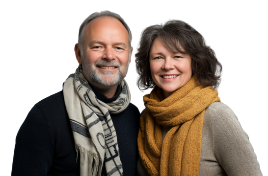 A middle-aged couple, smiling and wearing casual with scarves around their necks, against a transparent background
