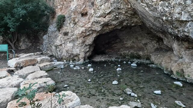 Gideon's Spring emerging from a cave in Ein Harod National Park, located in the picturesque Beit Shean Valley, Israel. 