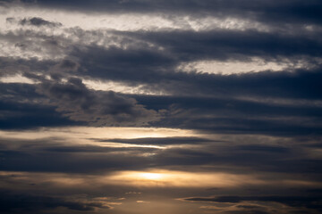 Clouds Sunset Sky: Atmospheric layers during golden hour sunset, showcasing layered cloud formations.