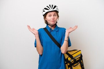 Young English woman with thermal backpack isolated on white background having doubts while raising hands