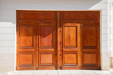 portal garage elegant brown wooden home door with four part on white facade building