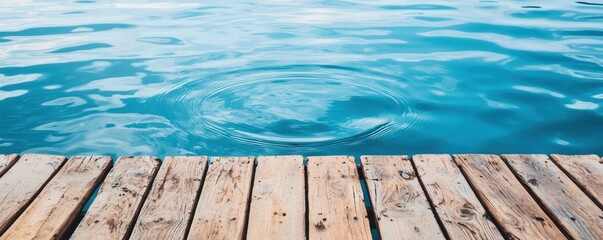 Obraz premium Mindful living with wellness and peace concept. Calm water surface with wooden dock and ripples.