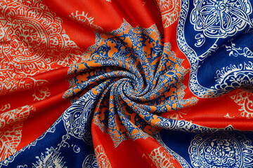 Vibrant Mandala Fabric Swirl: Red, Blue, and Orange Textile Design