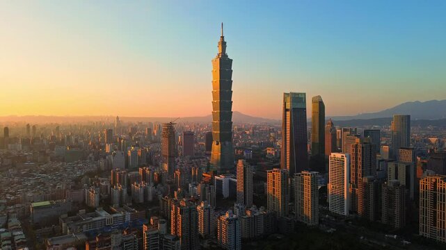 Aerial 4K footage of Taipei City Skyline in Taiwan. It is the Financial District of Taipei, capital city of Taiwan during sunset. - Powered by Adobe