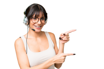 Telemarketer caucasian woman working with a headset over isolated background pointing finger to the side and presenting a product