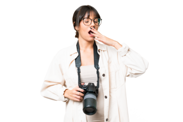 Young photographer caucasian woman over isolated chroma key background yawning and covering wide open mouth with hand