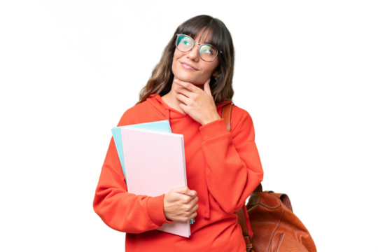 Young student caucasian woman over isolated background looking up while smiling