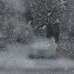 WINTER WEATHER - Wet snow on the glass wall