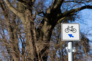 Bicycle path. Sign with an arrow indicating the movement of bicycles. Poland