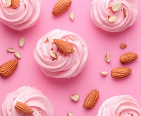 Delicious pastel pink cupcakes adorned with almonds on a vibrant pink background appealing to dessert lovers