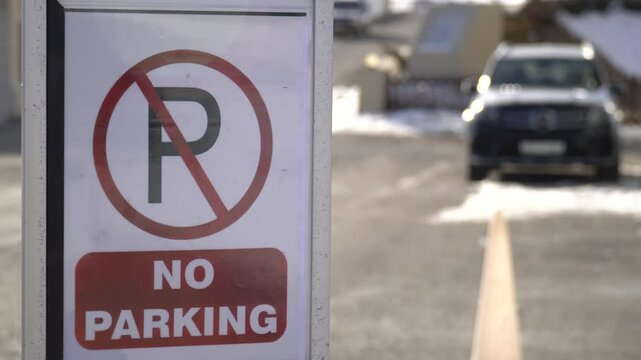 Road sign NO PARKING. Red sign prohibiting parking