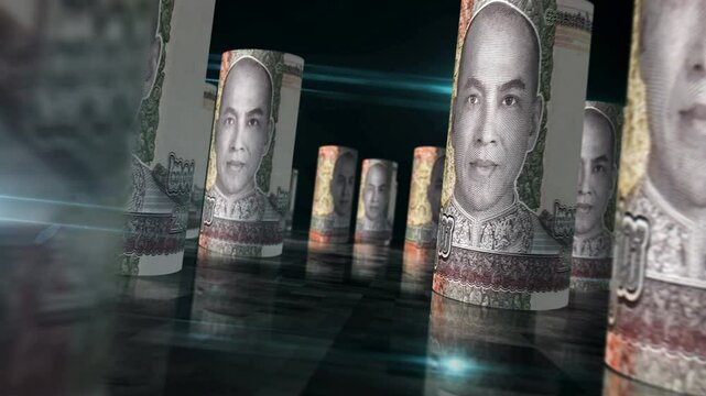 Cambodia money Cambodian riel rolls loop 3d. Money on table. Seamless and loopable abstract concept of economy, finance and business. Camera between 2000 KHR rolled banknotes.