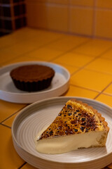 Burnt cheesecake, contains cream and blue cheese with almond sable and chocolate cheesecake served on plate