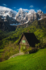 Lonely cute wooden hut on the slope, Julian Alps, Slovenia