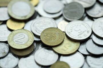 Big pile of different coins from various currencies and different countries around the world. Currency exchange