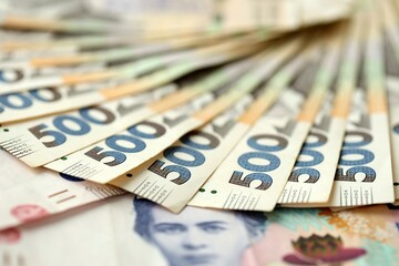 Big amount of different ukrainian hryvnia currency money bills in pile