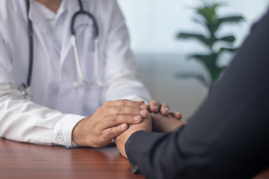 Asian male doctor talking to patient about mental health, health recovery, medical health care