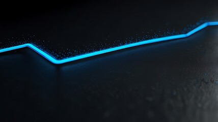 A glowing blue line on a dark surface, representing data trends or digital connections.