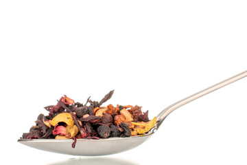 Carpathian forest aromatic tea with metal spoon, macro, isolated on white background.