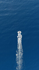 Motor boat moving on the sea, view from above.