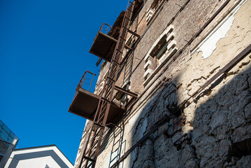Moara rosie, Historic Red Mill brick building in Chisinau, Moldova, iron ladder on an old wall
