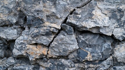 Fototapeta premium Cracked stone texture in shades of gray natural landscape close-up outdoor abstract conceptual view