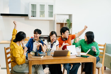 Teamwork and creativity with young adults collaborating on laptops and tablets in a cozy