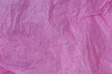 Recycling pink crumpled paper background.