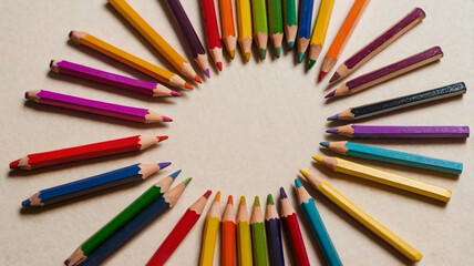 Fototapeta premium Colorful Pencils Arranged in a Circle on a Table