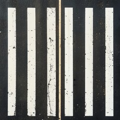 Fototapeta premium Worn pedestrian crossing with six white stripes and a center line on dark asphalt.